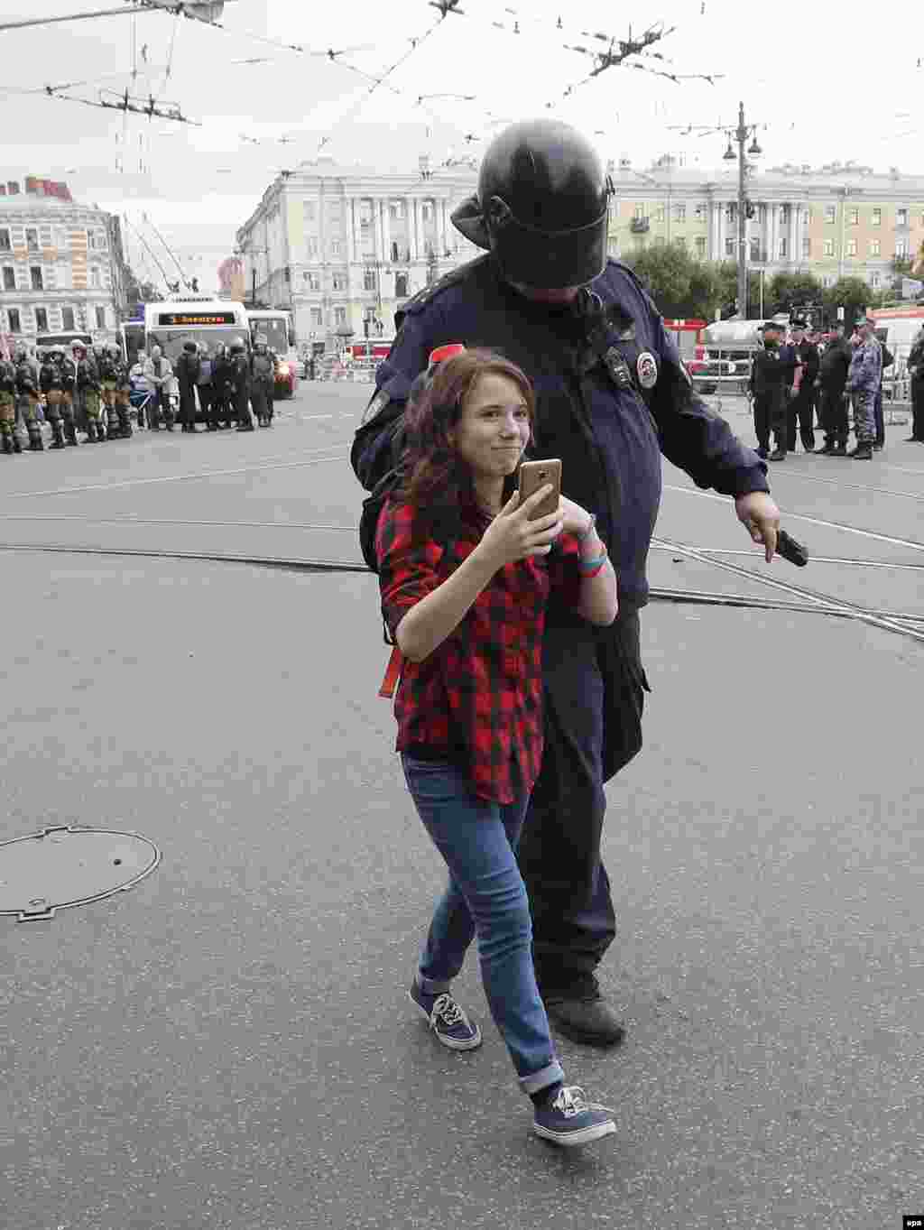 A young protester being detained in St. Petersburg. 