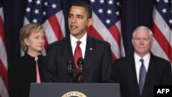 U.S. President Barack Obama is flanked by Secretary of State Hillary Clinton and Defense Secretary Robert Gates as he announces his administration's new plan for Afghanistan and the region.