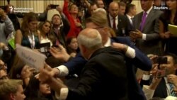 Man Bundled Away From Trump-Putin Briefing Man Bundled Away From Trump-Putin Briefing