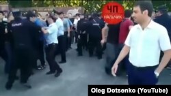 A screen-grab from a YouTube video posted on an account under the name of Oleg Dotsenko apparently showing scenes from a demonstration in Nalchik, the capital of Kabardino-Balkaria, during which Kabardians demanded that authorities open a probe into what they contend was a brutal crackdown targeting them.