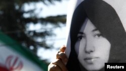 A demonstrator holds a picture of Sakineh Mohammadi Ashtiani at a protest in front of the Iranian Embassy in Rome earlier this month.