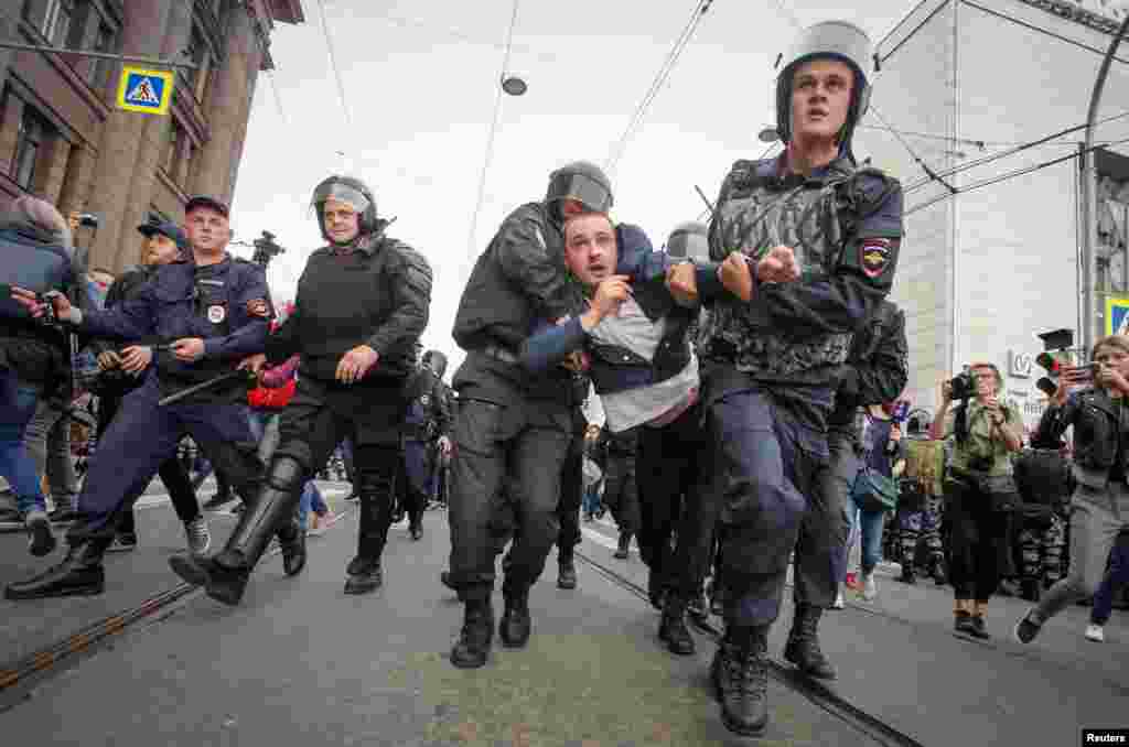 Police charging through protest lines in St. Petersburg. 