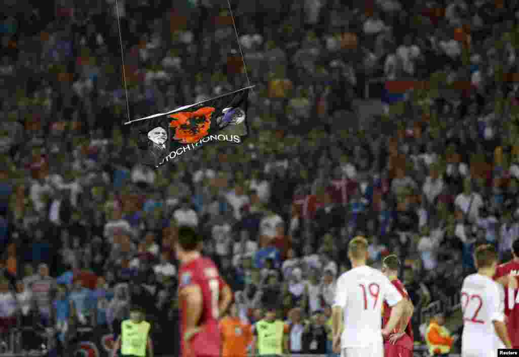 As it approached the field, it became clear that a flag was bearing a "Greater Albania" emblem -- a notion that would extend to Kosovo.
