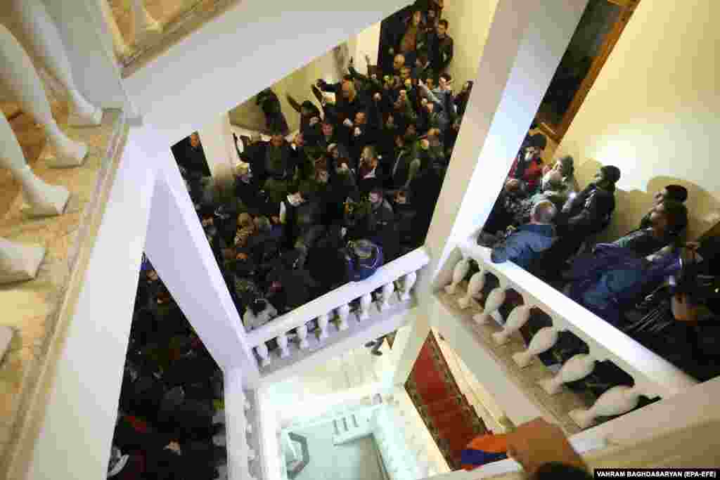 Protesters rampage inside a government building in Yerevan. The peace agreement would see Azerbaijan keep territory in Nagorno-Karabakh and surrounding areas taken from Armenian forces during the conflict. It also calls for Armenian troops to hand over areas they held outside the borders of Nagorno-Karabakh that had not been recaptured by Azerbaijani forces.