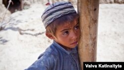 Khalid, 8, fled with his family from their home in Samangan Province.