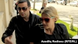 Detained Swedish journalist Charlotta Wijkström (R), who was deported from Azerbaijan with two colleagues on April 18.