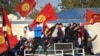 People protest during a rally against the results of a parliamentary vote in Bishkek on October 5.