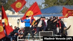 People protest during a rally against the results of a parliamentary vote in Bishkek on October 5.