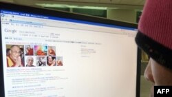 A Chinese user checks information about the Dalai Lama - one of Beijing's censored subjects - on the Internet.