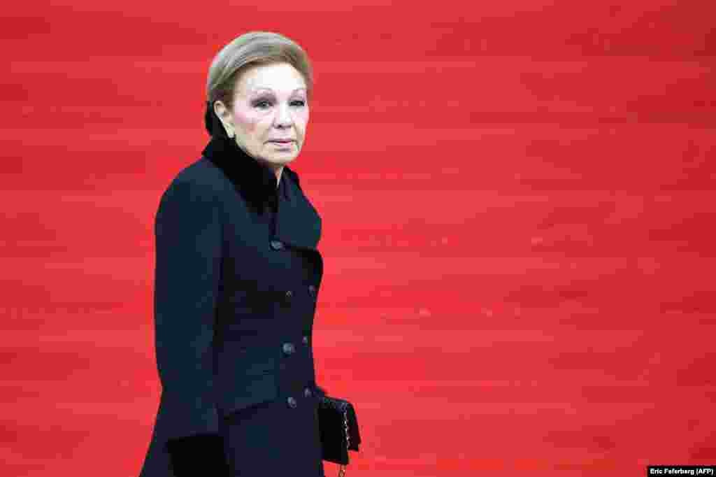 Iran's former Empress Farah arrives to attend a church service for French ex-President Jacques Chirac at the Saint-Sulpice church in Paris shortly after his death in September 2019. 