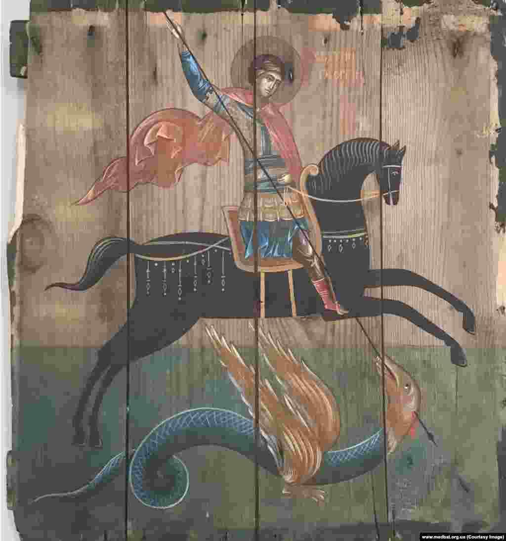 St. George slays a dragon on an ammunition-box panel from the front lines at Avdiyivka, Ukraine. Klymenko says: “Most people think of this war as of something very far away. It was important for me to show people that the war is real, that this ammunition box is real, and it stored real weapons that killed real people.” He told Reuters: “I don’t want this war to exist. And I don’t want this project to exist either.”