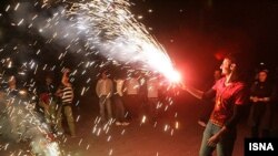Iranians set off fireworks during the celebrations leading up to Norouz