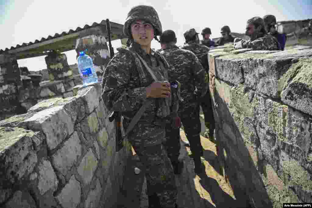 An Armenian soldier on the front line as troops fight to hold positions on October 18.  
