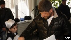 Chechen leader Ramzan Kadyrov casts his vote in Russian parliamentary elections at a polling station in Grozny on December 4.