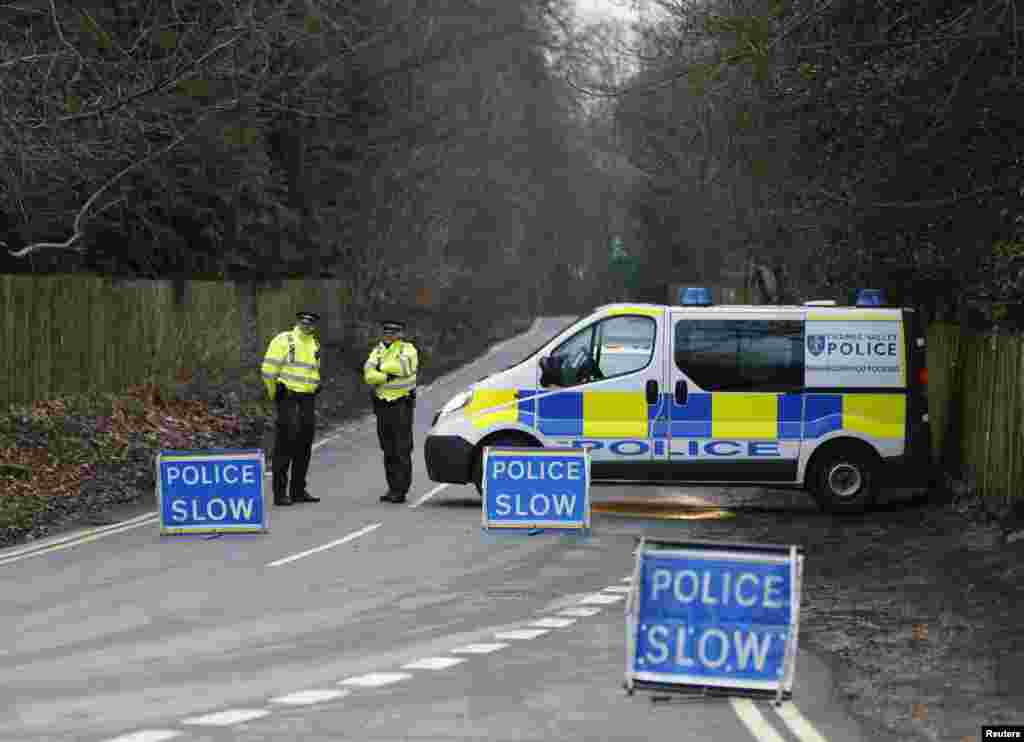 A police cordon blocks the road leading to Boris Berezovsky's house after he was found dead at his home near Ascot in Berkshire in as yet unexplained circumstances on March 23, 2013.  