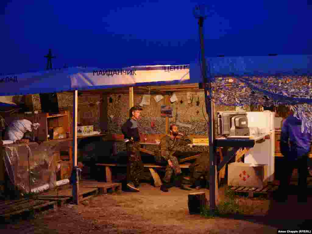 Blockaders watching television. The activists tap into electrical mains running past their camp but claim to pay for the power they use.  