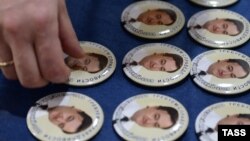 Pins bearing portraits of Sergei Magnitsky, for which the Magnitsky Act was named.