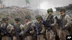 Lithuanian soldiers take part in a Lithuanian-German military exercise at a training range north of the Lithuanian capital Vilnius in May 2024.
